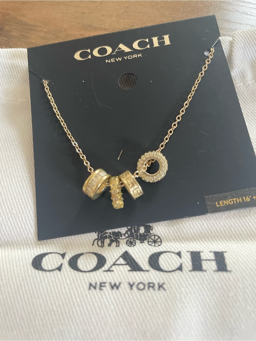 COACH Gold-Tone Multi-Charm Necklace with Pavรฉ Ring and Beads